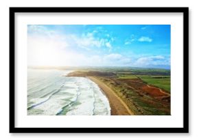 Flat design illustration showing ocean waves curving onto sandy beach meeting green fields