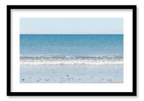 A picture of a beach with a sea background