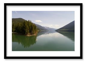 Trees on mountain range by river
