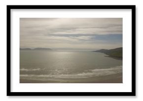 Seascape against cloudy sky