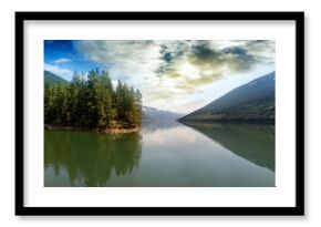 Scenic view of lake against cloudy sky