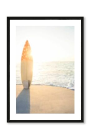 Surfboard on beach against sunny sky