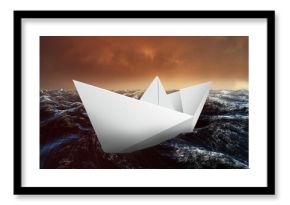 Paper boat floating on the sea