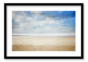 Flat design sandy beach stretching to horizon, showcasing smooth sand, calm sea and drifting clouds