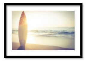 Surfboard on beach shore against sunny sky