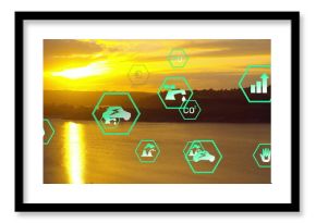 Glowing sun disc casting bright reflection on lake at sunset, with neon-green hex icons, copy space