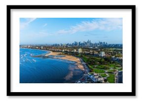 Aerial shot of the coastal Melbourne city in Australia with buildings in on the shore