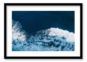 Aerial view of sea waves breaking beach