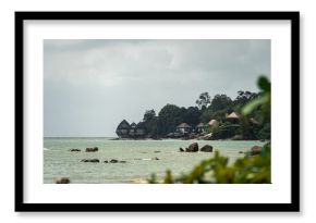 Scenic view of a rocky beach with beautiful hotels at Langkawi, Malaysia