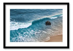 A wave breaking on a beach in central California.