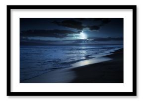 This photo illustration depicts a quiet and romantic moonlit beach in Maui Hawaii.