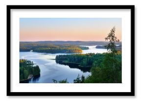 Clear blue Saimaa lake at sunset, Finland, aerial view. Picturesque panoramic scenery. Atmospheric landscape. Pure nature, ecology, environmental conservation, eco tourism, travel destinations