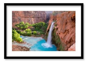 A view of Havasu Falls from the hillside above the falls. The turquoise colored water flowing in to the pool below is surreal and one of a kind in the desert of Arizona