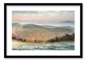 Scenic view of sea against mountains during sunset