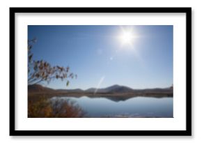 Lake against blue clear sky