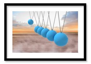 Newtons cradle above beach