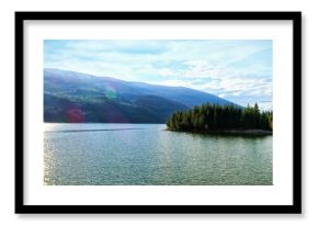 Idyllic view of river by mountains