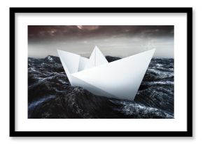 Paper boat floating on the sea