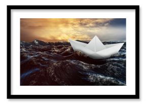 Paper boat floating on the sea