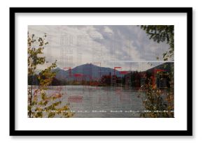 Displaying lake view reflecting mountains at lakeshore, with data overlay, red blocks and branches