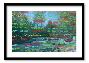 Displaying screen overlaying stock tickers with yellow line graphs on rocky river with conifers