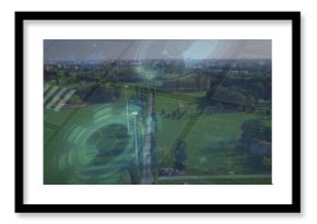 Stretching central tree-lined walkway through urban park, showing lamp posts, benches, pond and HUD
