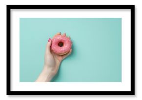 Person Holding Pink Donut With Sprinkles