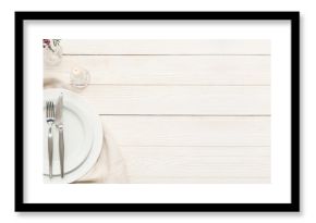 Beautiful table setting with flowers and candle on white wooden background with space for text