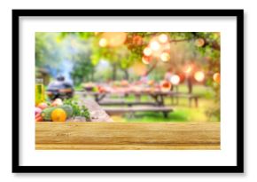 summer time party in backyard garden with grill BBQ and vegetables, wooden table, blurred background