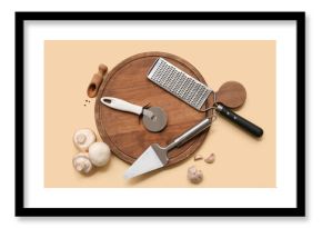 Composition with stainless steel pizza cutter, kitchen utensils, mushrooms and spices on color background