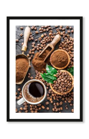 Roasted coffee beans, ground coffee and cup of coffee on wooden table.