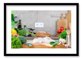 Food background. Healthy eating, cooking and blogging banner. Cutting board with raw organic onion, farm broccoli and cauliflower, fresh herbs on cozy kitchen with wooden table, kitchenware 