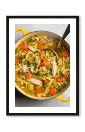 A comforting pot of chicken noodle soup, richly textured with noodles, carrots, celery, and shredded chicken, with a ladle