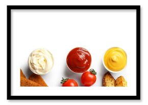 Bowls of ketchup, mayonnaise and mustard with snacks isolated on white background