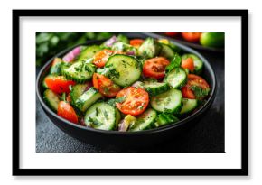 A vibrant avocado, tomato, and cucumber salad in a sleek black bowl rests on a white tabletop. Fresh ingredients pop with color, symbolizing health, freshness, and minimalist modern dining.  