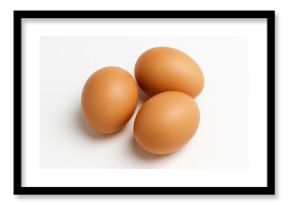 Three eggs displayed on a plain white surface