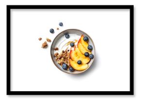 Granola bowl with greek yogurt, peach and blueberries isolated