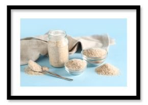 Jar and bowls with psyllium husk powder on blue background