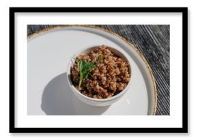 A plate of buckwheat in a cafe. 