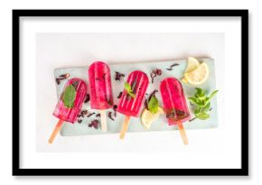Frozen Hibiscus Water lollipops, sweet Hibiscus tea popsicles with lemon and mint, low-calorie healthy gelato