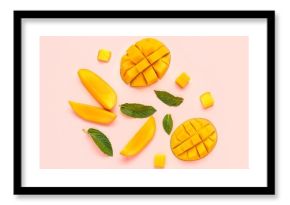 Fresh cut mangoes on pink background