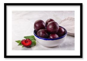 Raw ripe purple plum heap