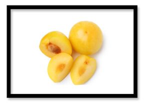 Whole and cut yellow cherry plums isolated on white, top view
