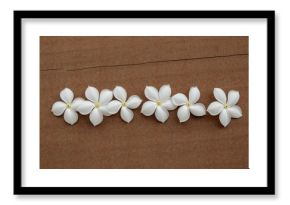 Cluster of Jasmine Flowers on a Wooden Surface