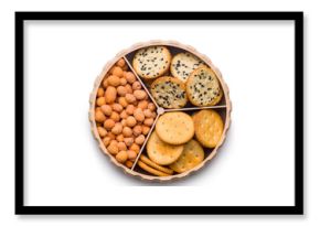 Various salty snacks in a round bowl isolated on white background.