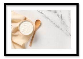 Wooden bowl of tasty yogurt on white background