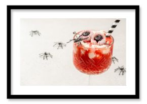 A glass of strawberry tea smoothie with whipped cream for Halloween