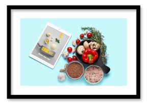 Digital recipe book, vegetables, spices and flax seeds on color background