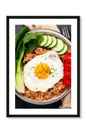 ndonesian nasi goreng (fried rice) served on a plate.