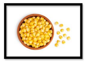 corn seeds in ceramic bowl isolated on white background. Top view. Flat lay